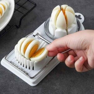Home 75 Multifunctional egg cutter tool with stainless steel wire for precise slicing and convenient storage.