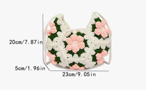 Handmade crescent crochet crossbody bag with soft texture and delicate floral style