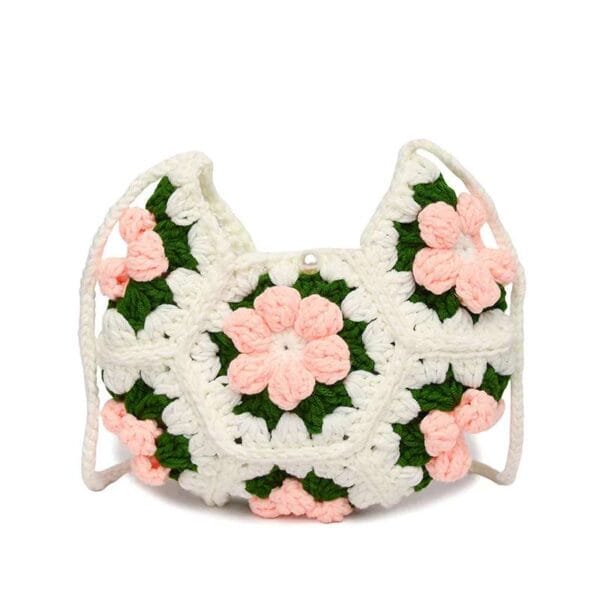 Handmade crescent crochet crossbody bag with soft texture and delicate floral style