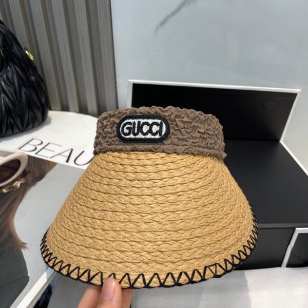 Original Gucci Straw Hat with stitched black brim and ruched brown logo band – pre-owned in excellent condition.