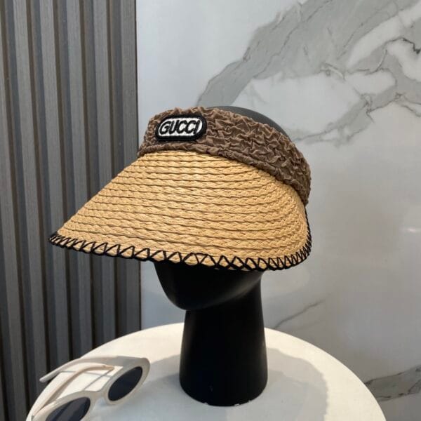 Original Gucci Straw Hat with stitched black brim and ruched brown logo band – pre-owned in excellent condition.