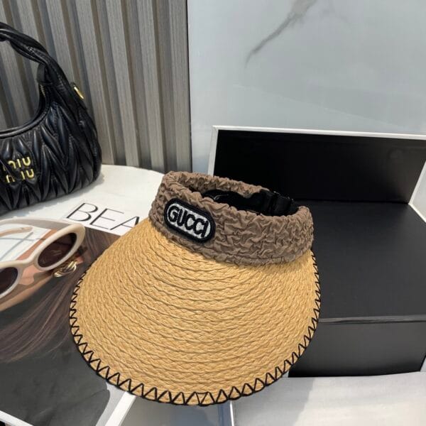 Original Gucci Straw Hat with stitched black brim and ruched brown logo band – pre-owned in excellent condition.
