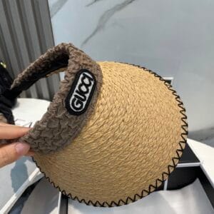 Original Gucci Straw Hat with stitched black brim and ruched brown logo band – pre-owned in excellent condition.

